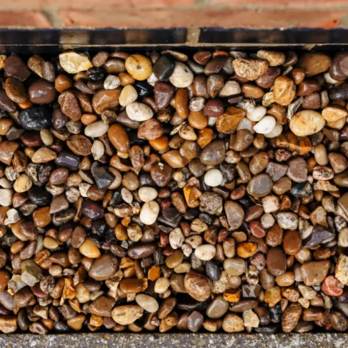 Trent pea gravel used in a house border for attractive weed suppression and drainage